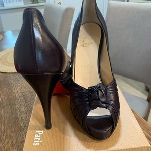 Christian Louboutin Black Lambskin Jenny Knotted Peep Toe Pumps.